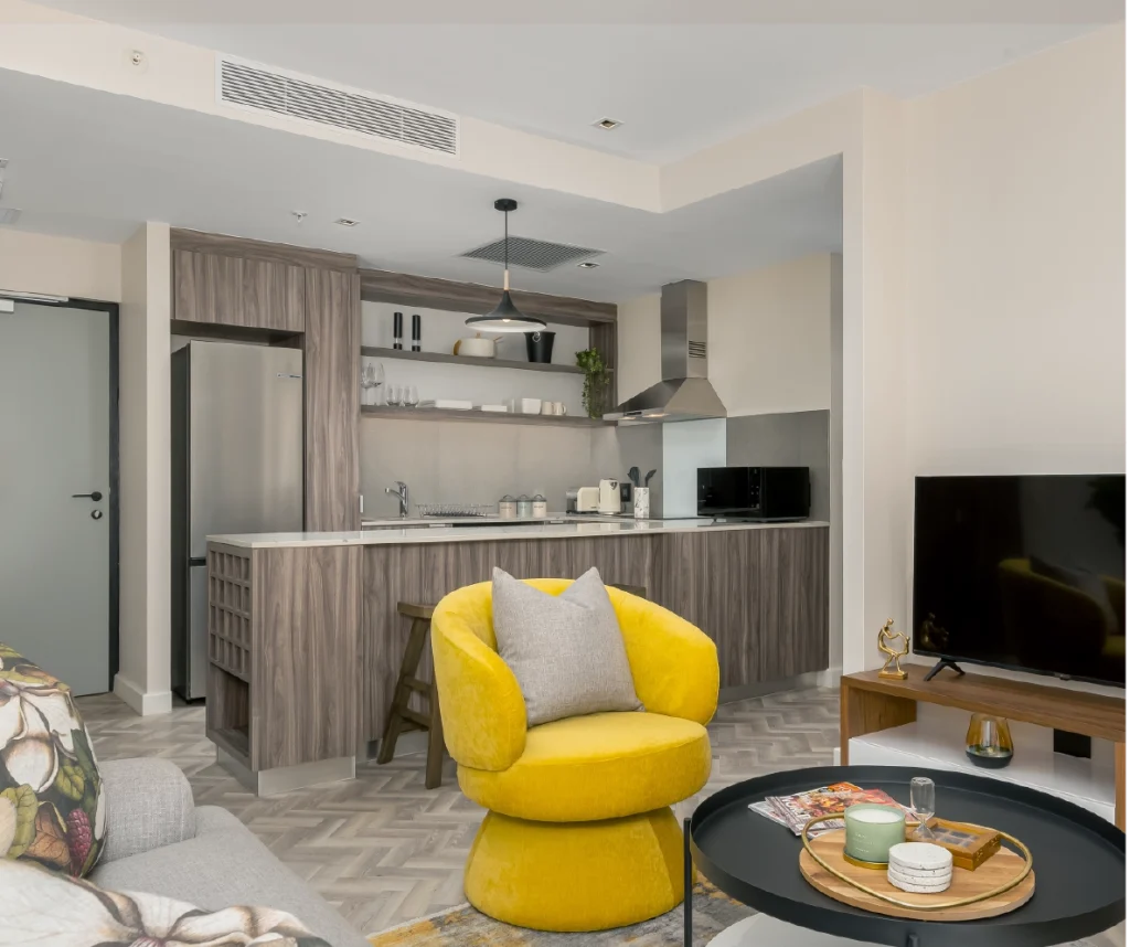 Interior living space of a furnished apartment at Foreshore Place